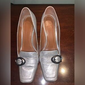 Silver Coach pumps—great detailing
